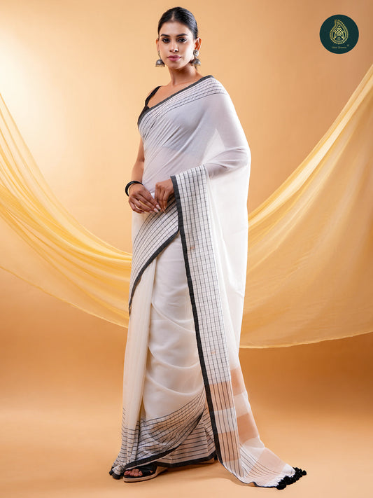 Chic White - Mul Cotton Saree with Grid Border & Tassels
