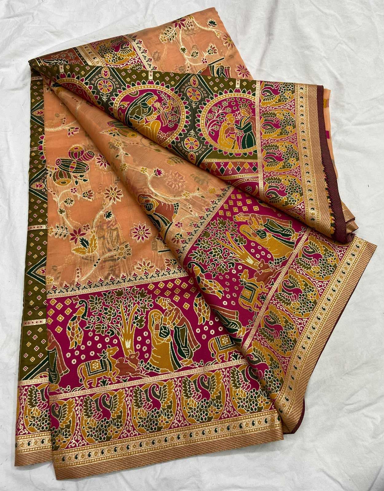 Colorful traditional fabric with intricate patterns on a white background