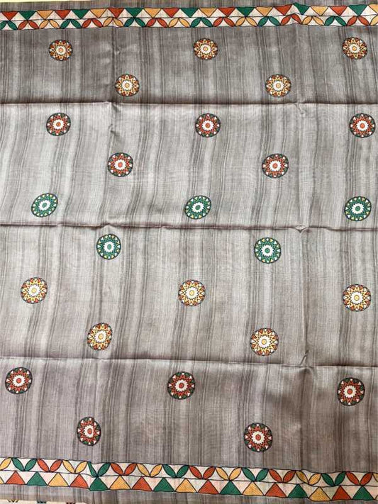 A gray striped fabric, likely a saree or scarf, decorated with small circular floral motifs in red, green, and gold, featuring a geometric pattern border at the top and bottom.