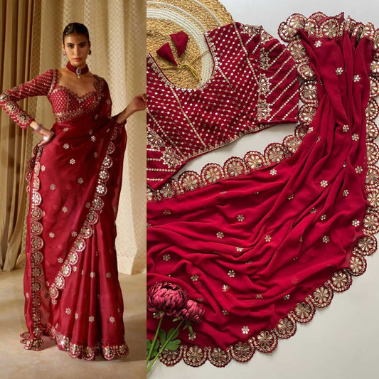 Red saree with gold embroidery worn by a model, close-up of saree details.