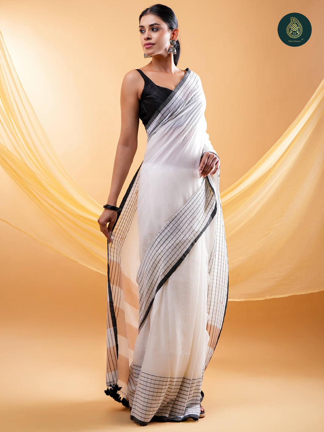 Chic White -  Mul Cotton Saree with Grid Border & Tassels