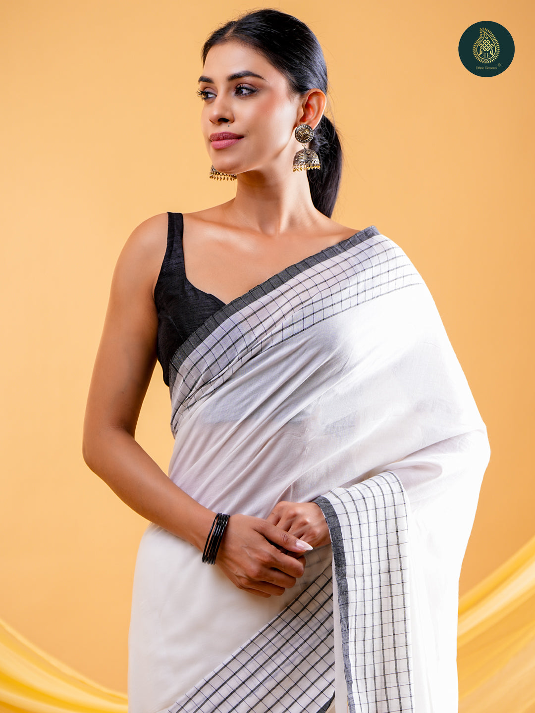 Chic White -  Mul Cotton Saree with Grid Border & Tassels
