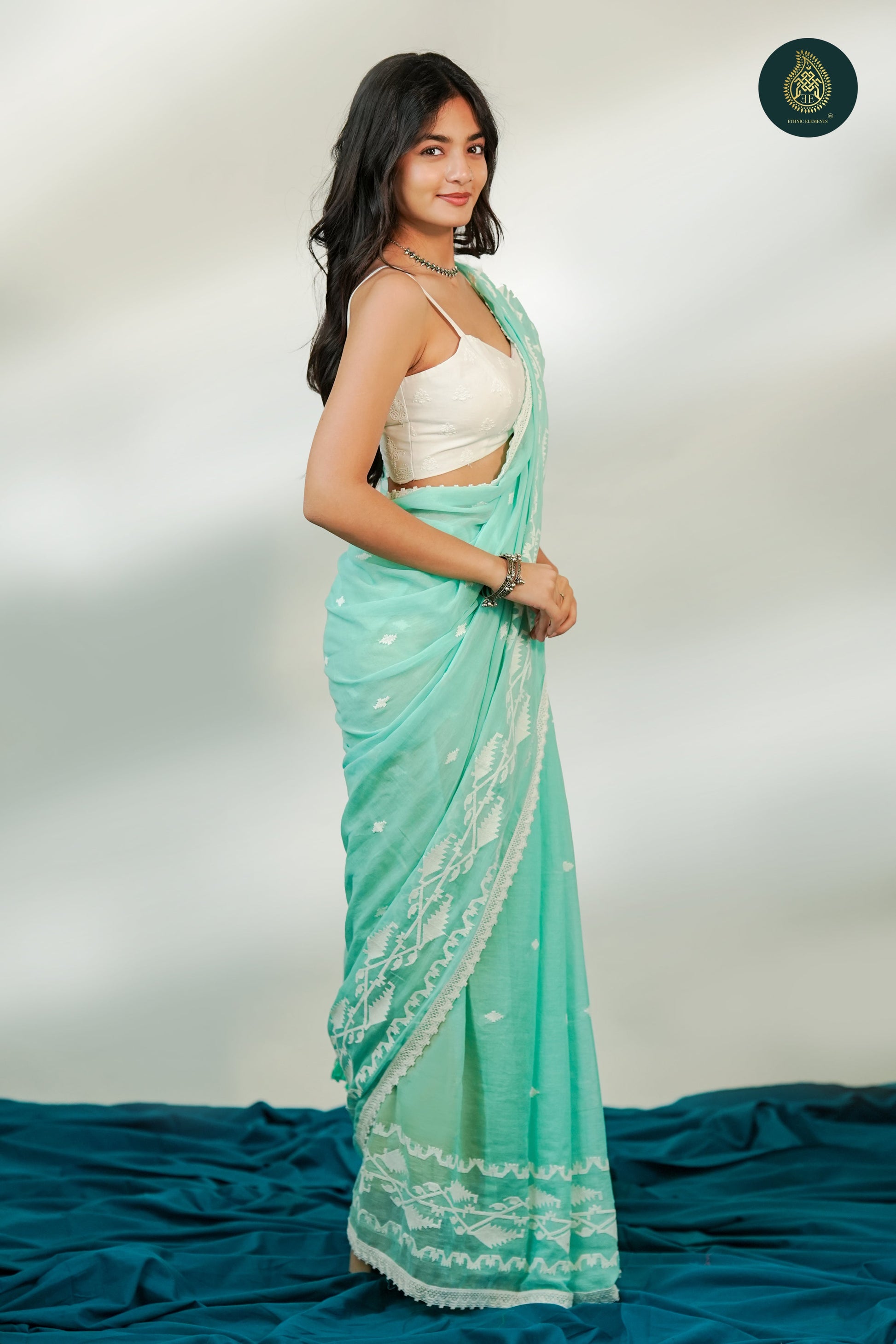 Mint Green Mul Cotton Saree with White Woven Motifs
