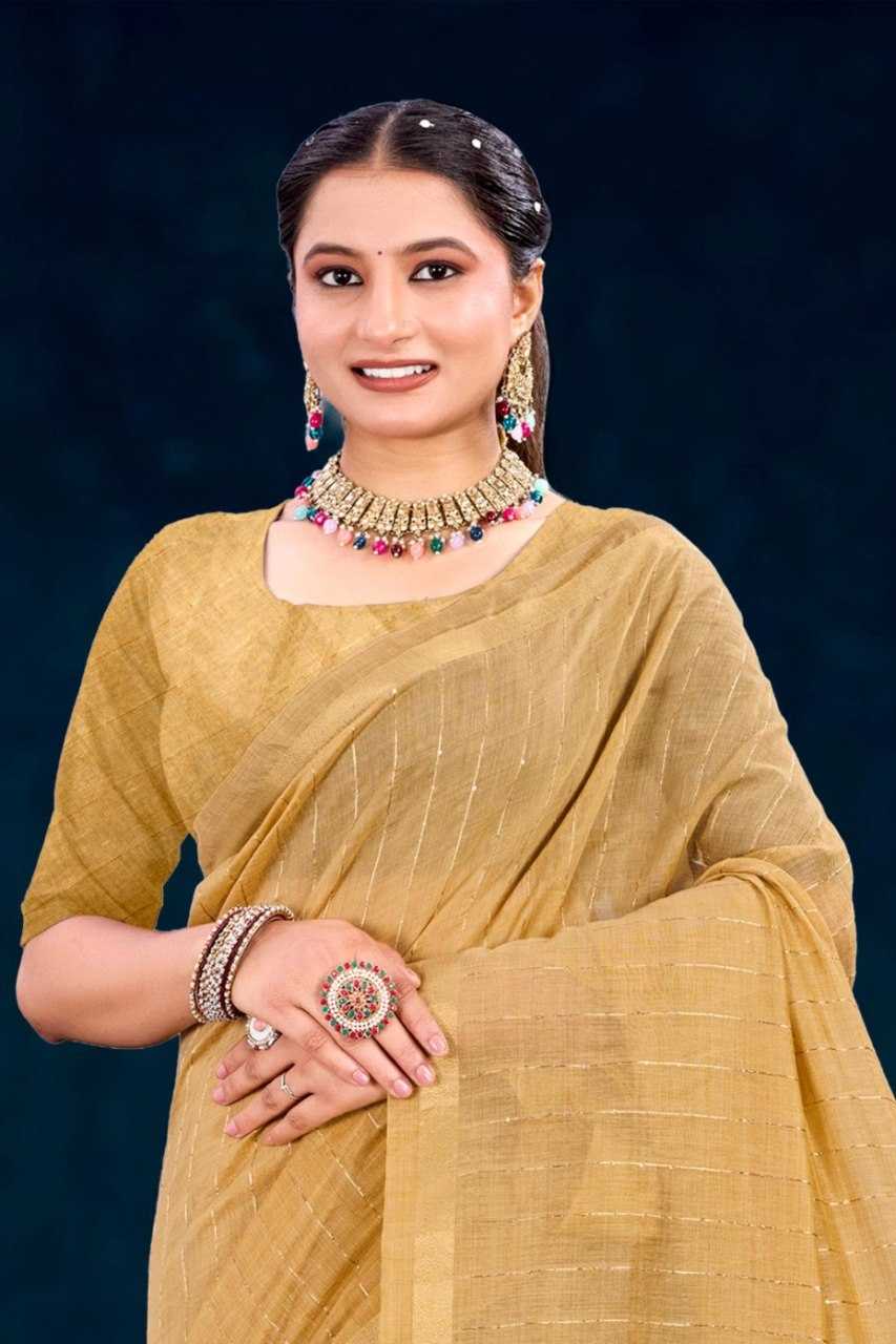 Woman in a yellow saree with jewelry against a dark background