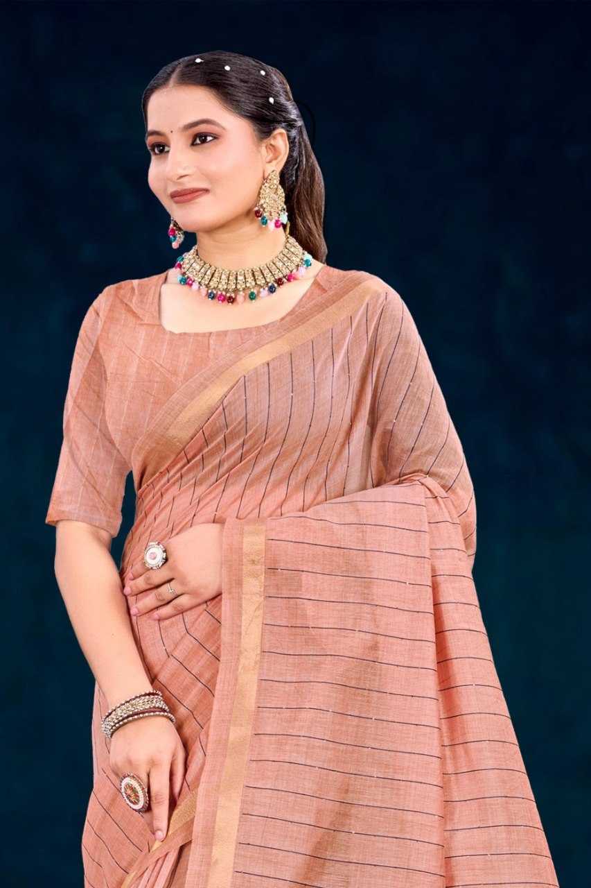 Woman wearing a peach saree with a dark blue background