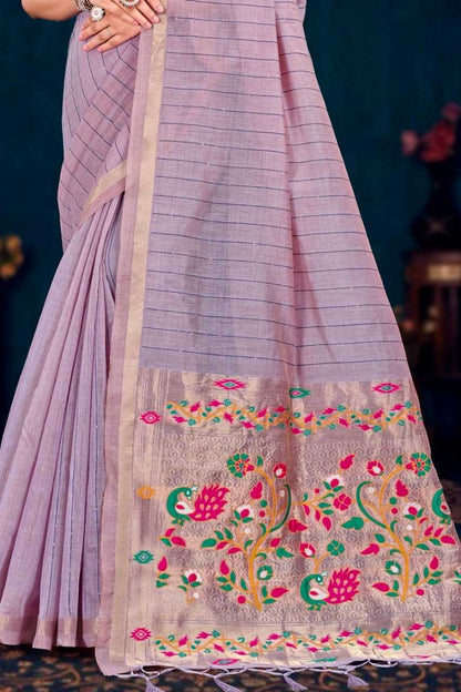 Purple saree with floral embroidery on a dark background