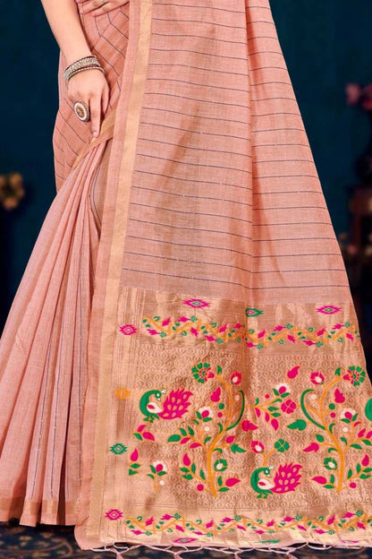 Pink saree with floral embroidery on a dark background