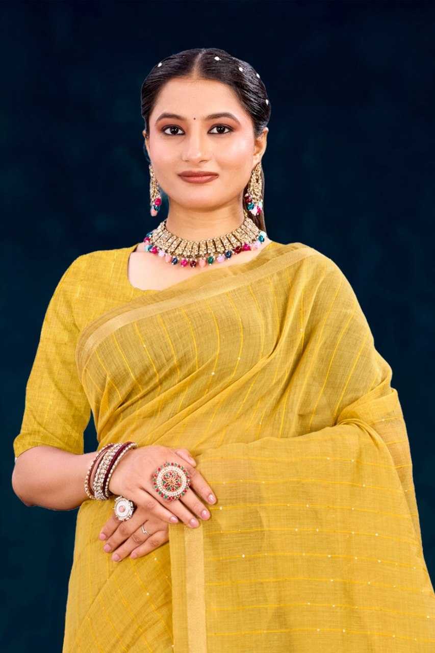 Woman in a yellow saree with jewelry against a dark background