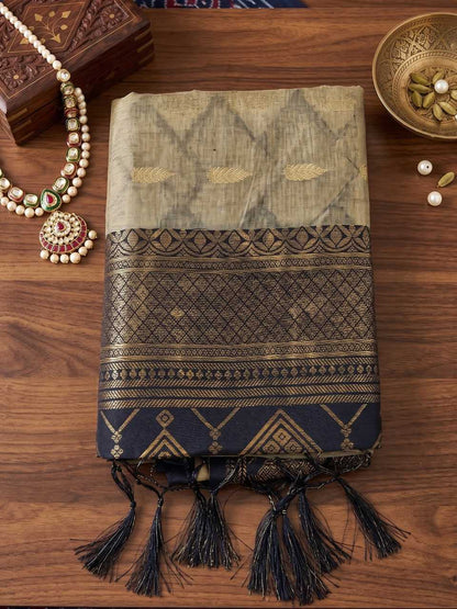 Textile with intricate patterns and tassels on a wooden surface