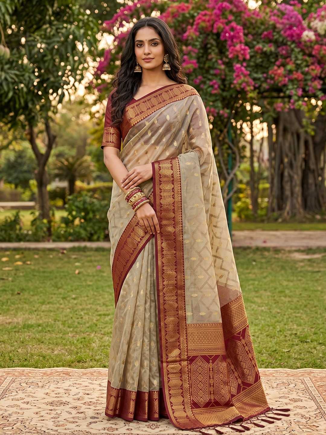 Woman wearing a traditional saree in a garden setting