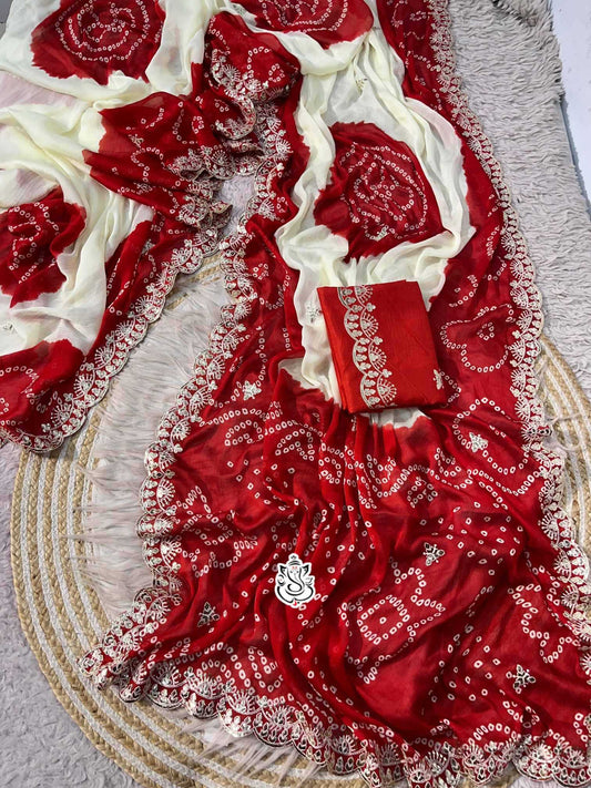 Red and white patterned fabric with a decorative design on a textured surface