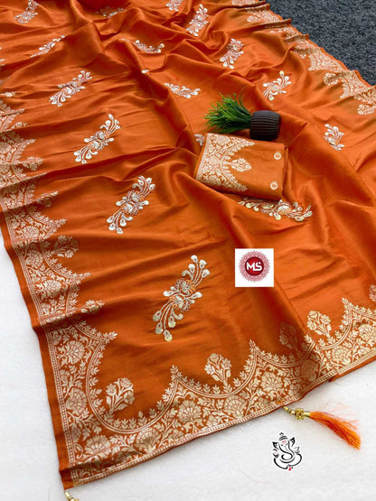 Orange saree with white embroidery on a white background