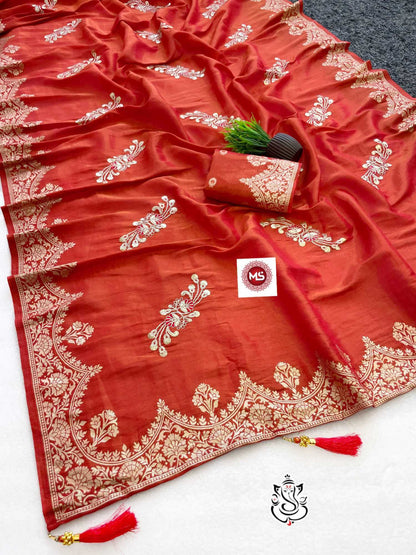 Red saree with white embroidery on a white background