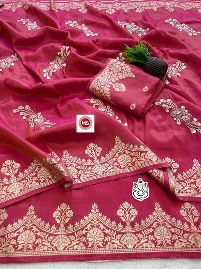Pink saree with white embroidery and a brand logo in the center.