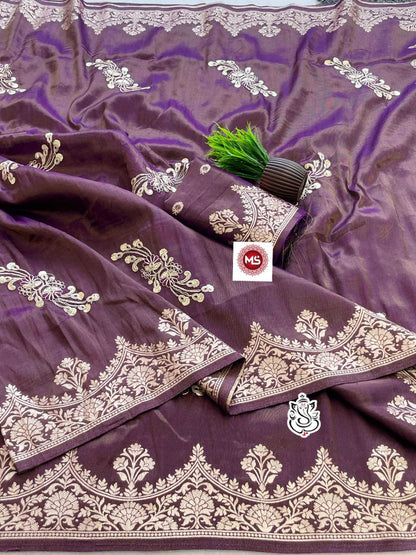 Purple fabric with gold embroidery and a brand logo in the center.