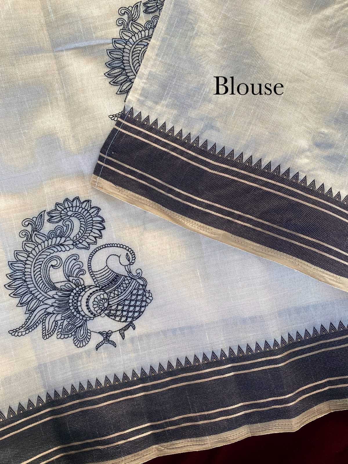 White blouse with black embroidery and border details on a textured background