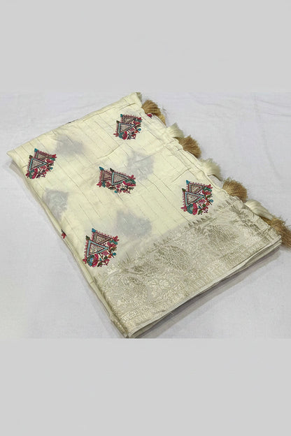 A cream-colored georgette saree with a wide zari border and embroidered motifs, displayed on a white background with text detailing the specifications.