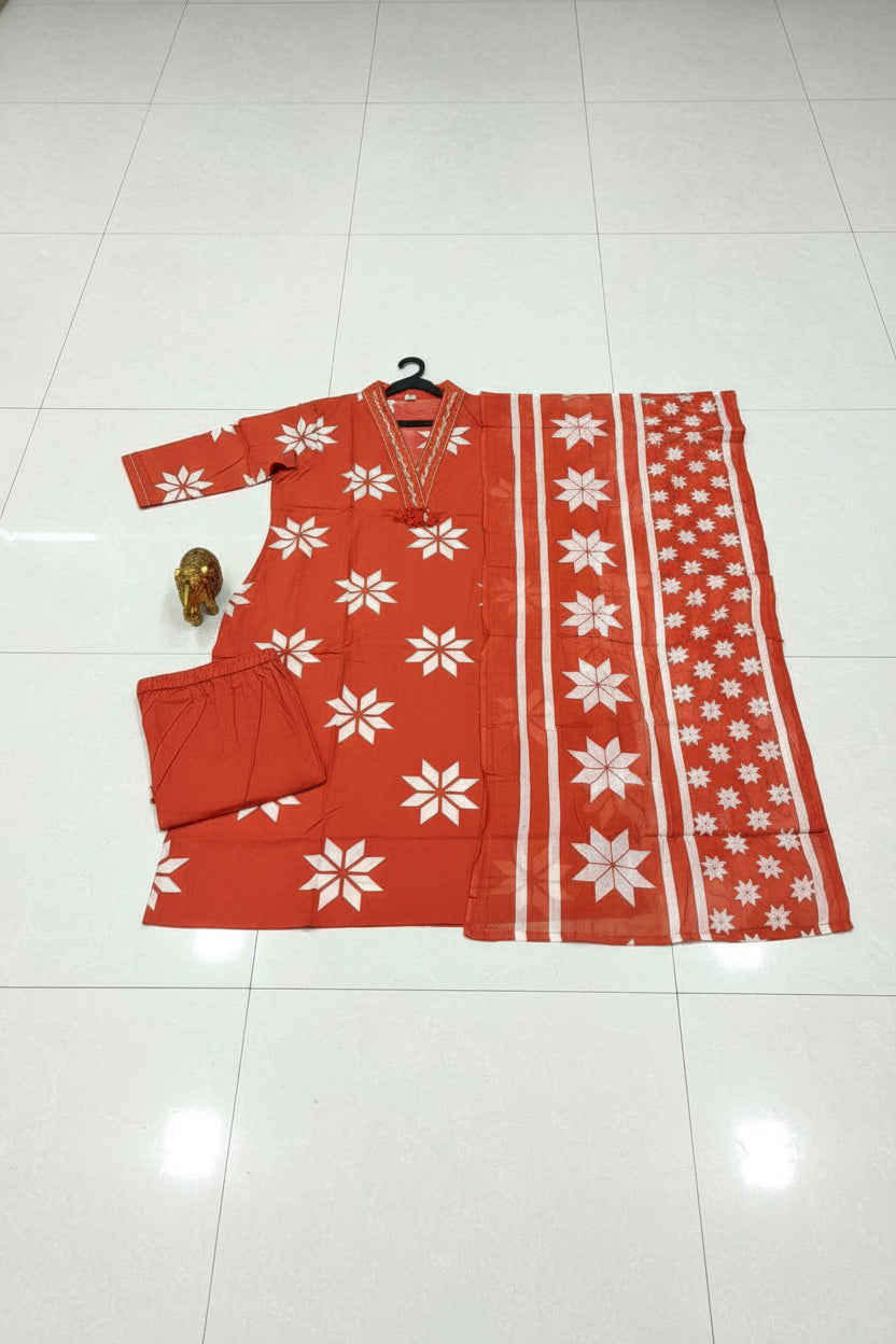 Red fabric with white floral patterns on a table
