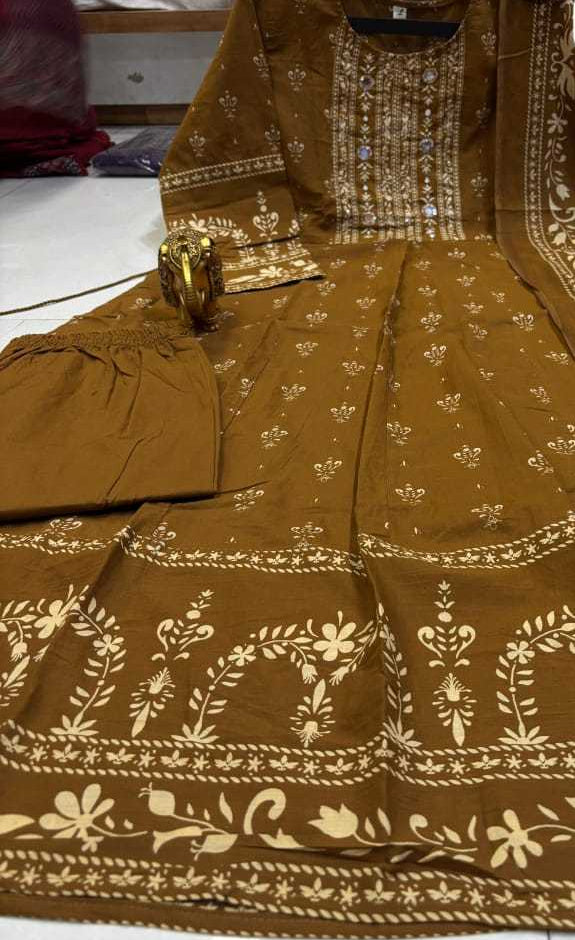 Brown embroidered outfit with white patterns on a white surface