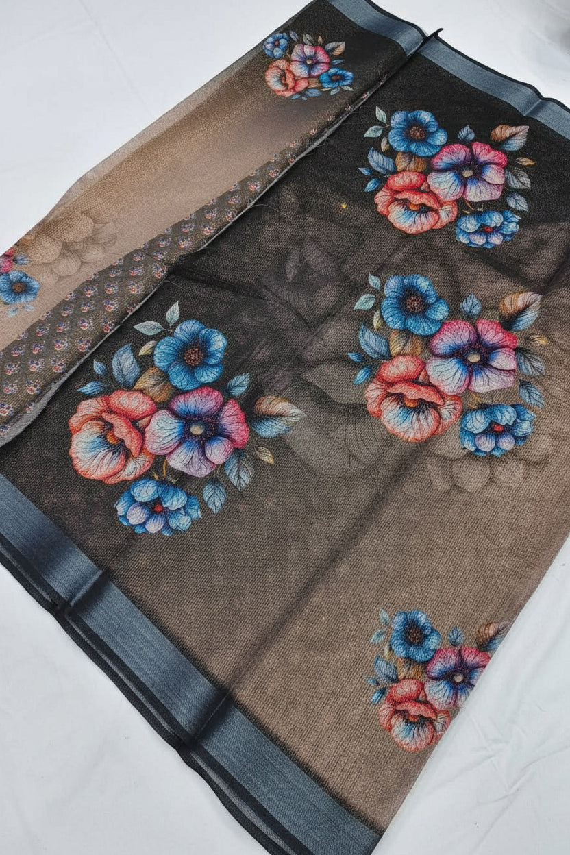 Embroidered floral design on a sheer fabric with a visible brand logo.