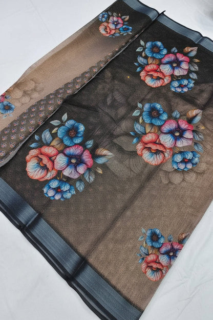 Embroidered floral design on a sheer fabric with a visible brand logo.