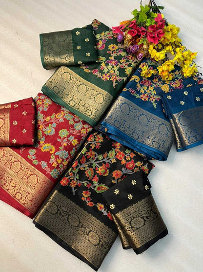 A flat-lay display of six traditional Indian silk sarees with intricate floral patterns and metallic zari borders, arranged on a light fabric background with a decorative flower bouquet.
