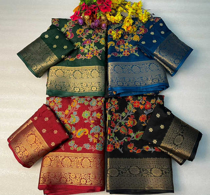 Four folded ethnic sarees with floral and paisley patterns and ornate gold zari borders, arranged in a 2x2 grid on a white background with a bouquet of flowers at the top.