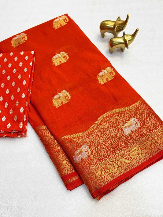 Red saree with gold elephant patterns on a white background