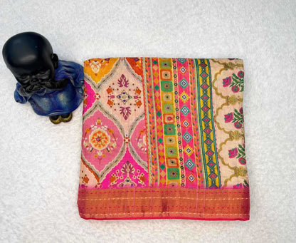 Colorful patterned fabric with a small black and blue toy figure on a white background