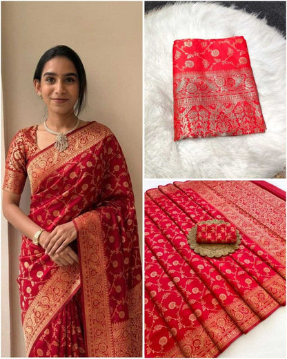 Red saree with gold patterns worn by a woman, displayed on a white surface.