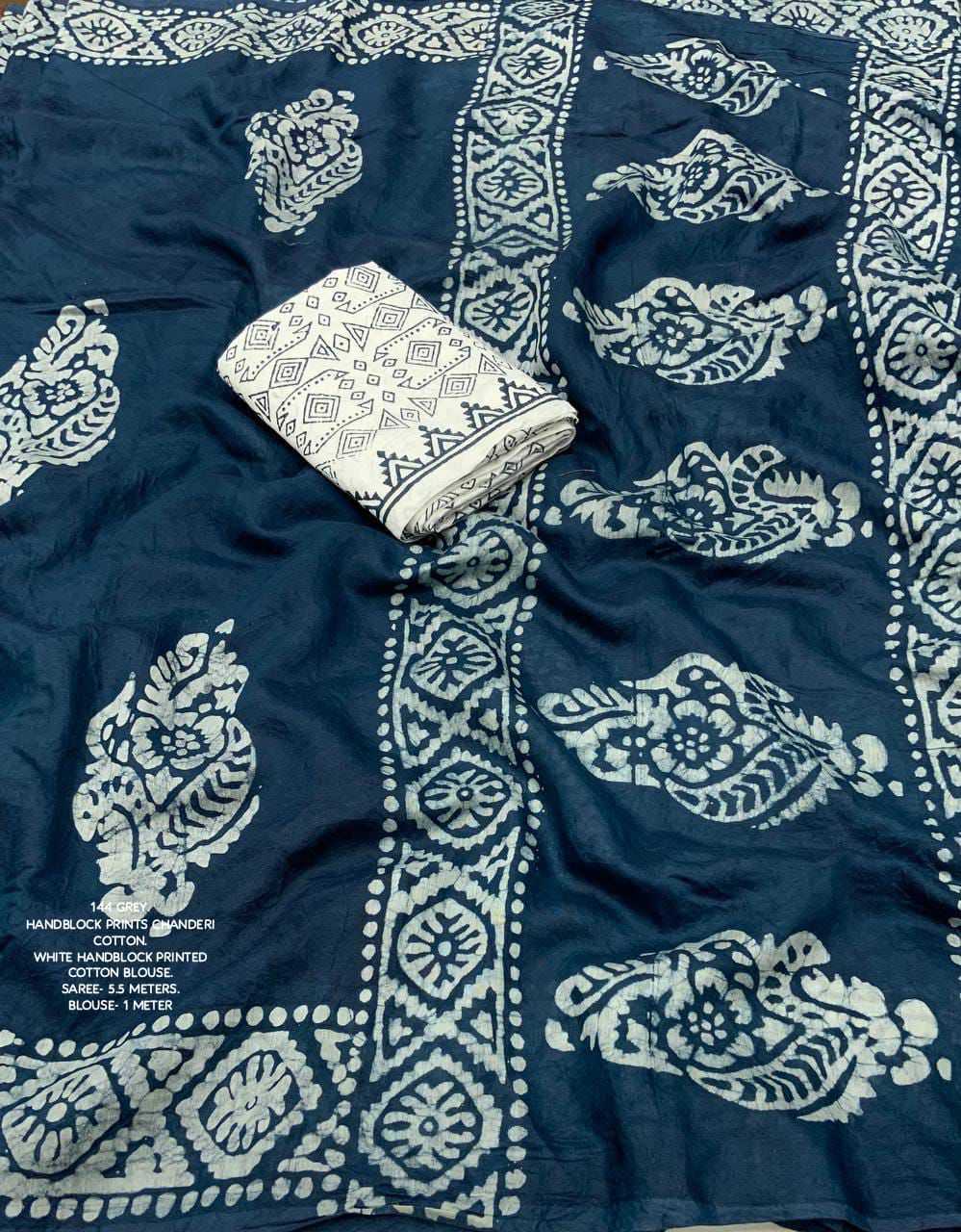 Navy blue fabric with white pattern and a white pouch on top