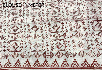 Textile with red geometric pattern on a white background, labeled 'Blouse 1 Meter'.