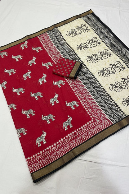 Red fabric with elephant patterns on a white background
