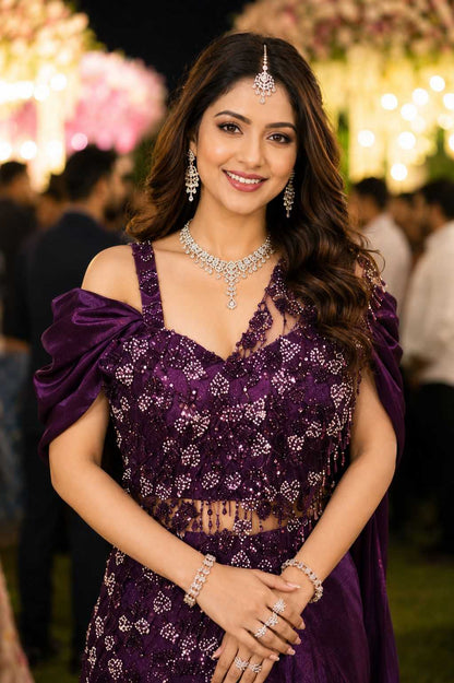 Woman in a purple dress with jewelry at an event