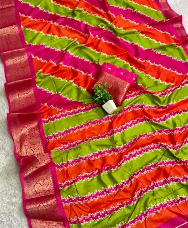 A vibrant striped saree with diagonal bands of lime green, orange, and magenta pink, featuring a wide metallic gold border and a matching small fabric blouse piece.