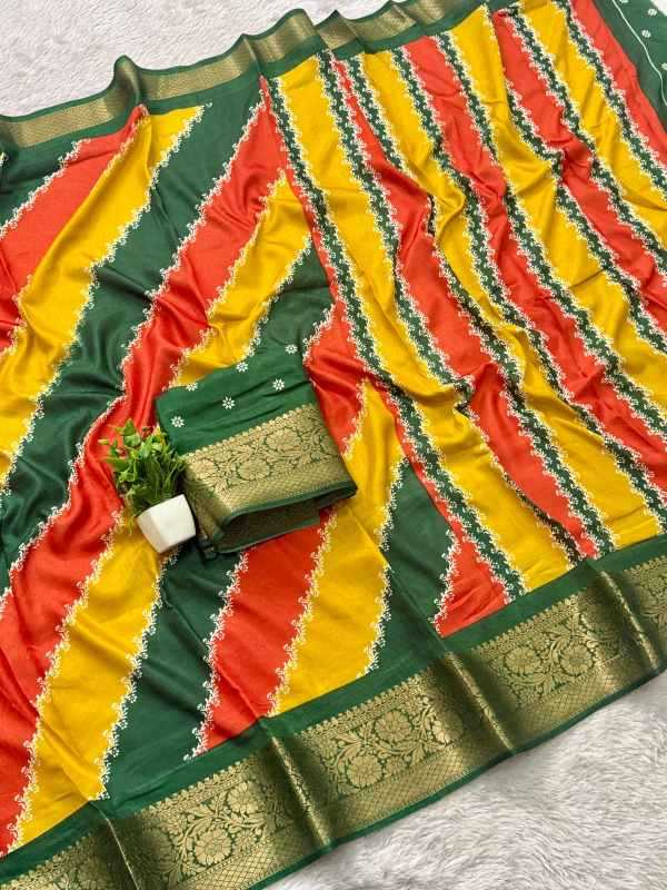 A multicolor striped saree fabric with diagonal bands of green, yellow, and red, featuring intricate gold zari woven borders and a matching folded green blouse piece with gold embroidery, styled on a white textured background.