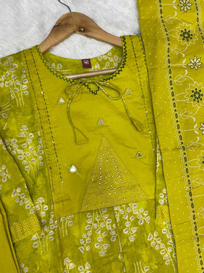 Green embroidered traditional outfit on a hanger with a white background