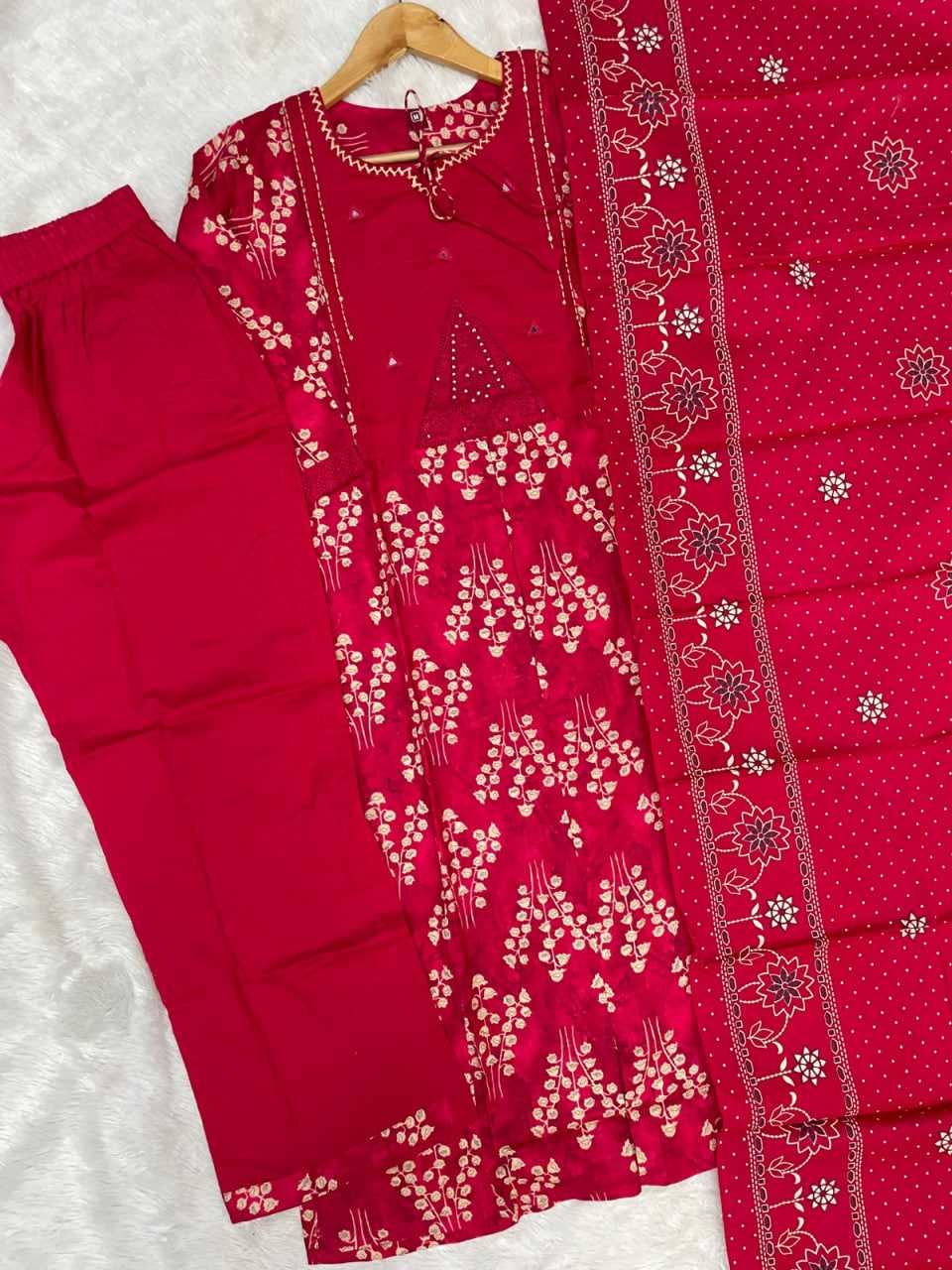 Red traditional outfit with floral patterns on a white background