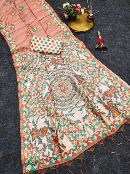 A peach-colored printed fabric set, likely a saree or dupatta with a matching small pouch, displayed on a dark gray textured background with decorative props.