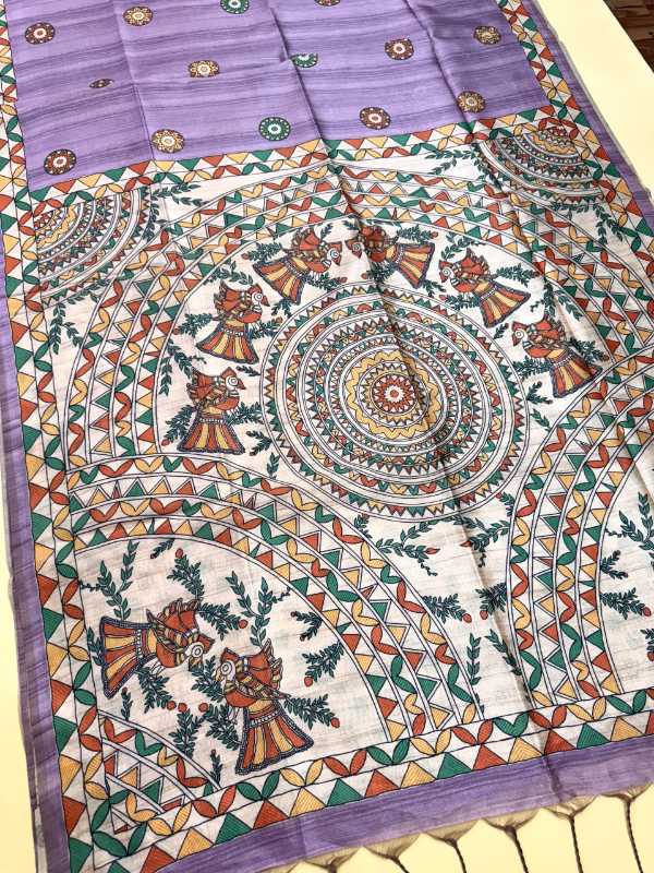 Colorful traditional fabric with intricate patterns on a white background