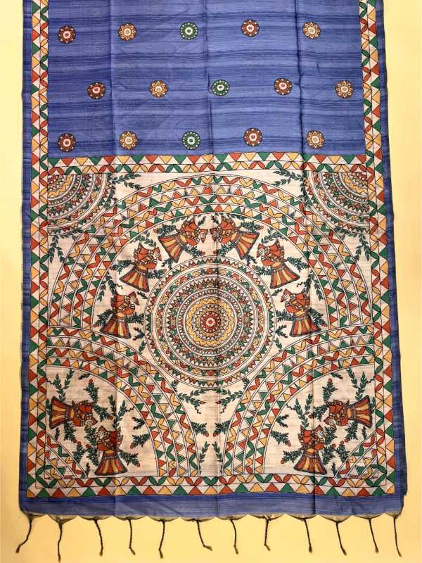A traditional Indian handloom textile, likely a saree or dupatta, featuring a vibrant blue upper section with small floral motifs and a highly detailed, multicolored mandala and geometric patterned lower section with tassels.