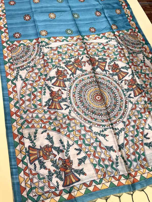 Colorful patterned fabric with intricate designs on a flat surface