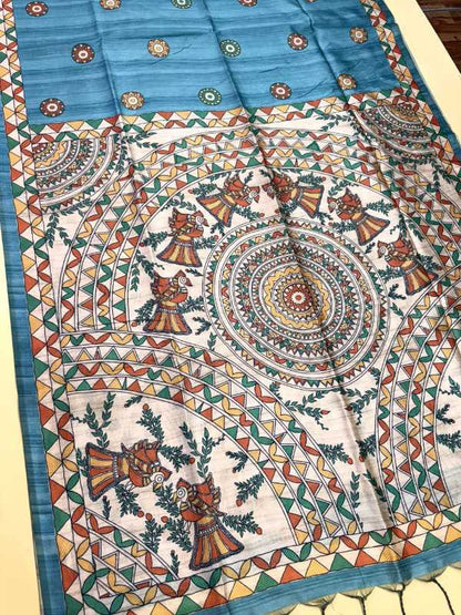 Colorful patterned fabric with intricate designs on a flat surface