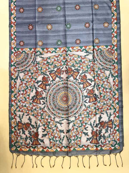 A rectangular handloom fabric piece, likely a saree or dupatta, featuring a blue-gray upper section with small floral motifs and a highly detailed multicolor hand-drawn mandala and geometric pattern on an off-white lower section, finished with a fringed hem.