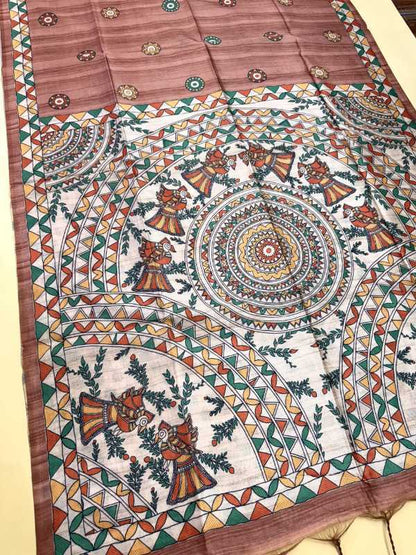 Colorful patterned fabric with intricate designs on a wooden surface