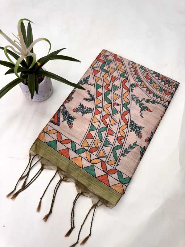 Decorative scarf with geometric pattern on a white surface with a plant.