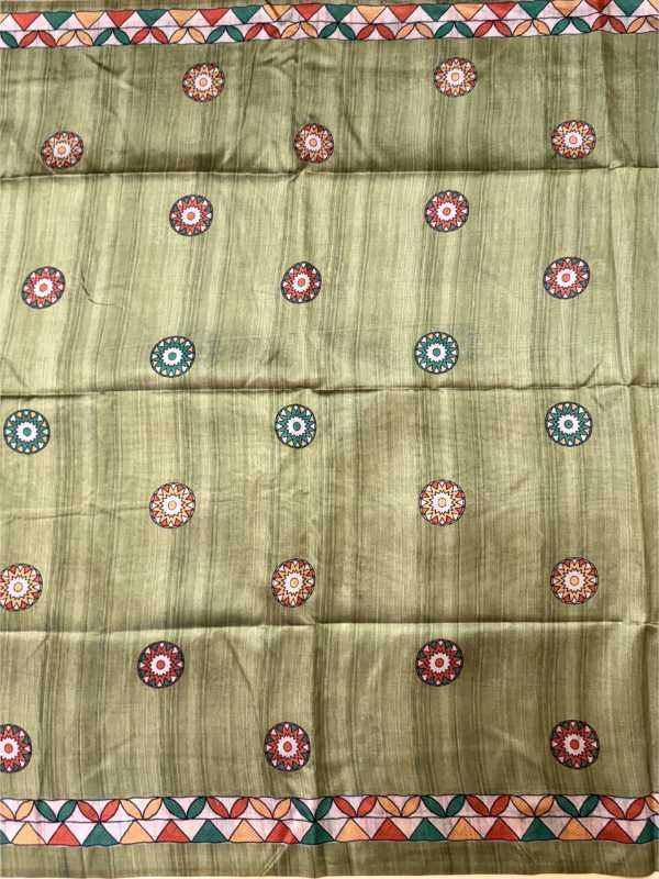 Green fabric with decorative patterns and border