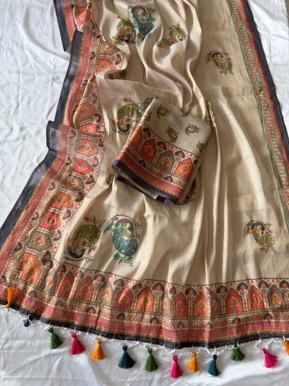 Traditional embroidered fabric with colorful patterns and tassels on a white background