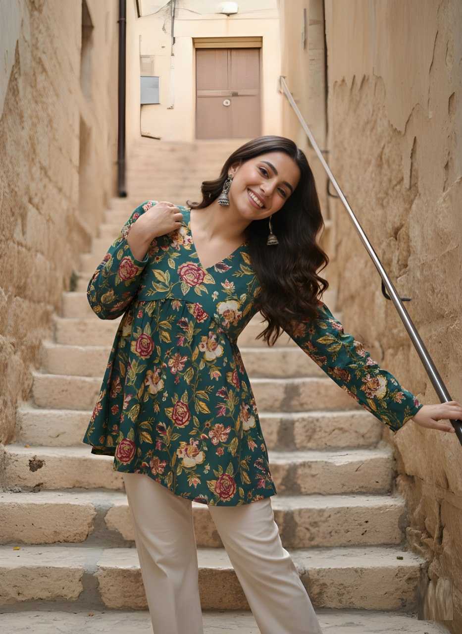 Woman in a floral dress standing on stone steps in an alleyway.