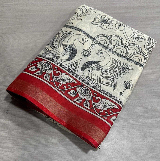 Folded fabric with peacock design on a gray surface